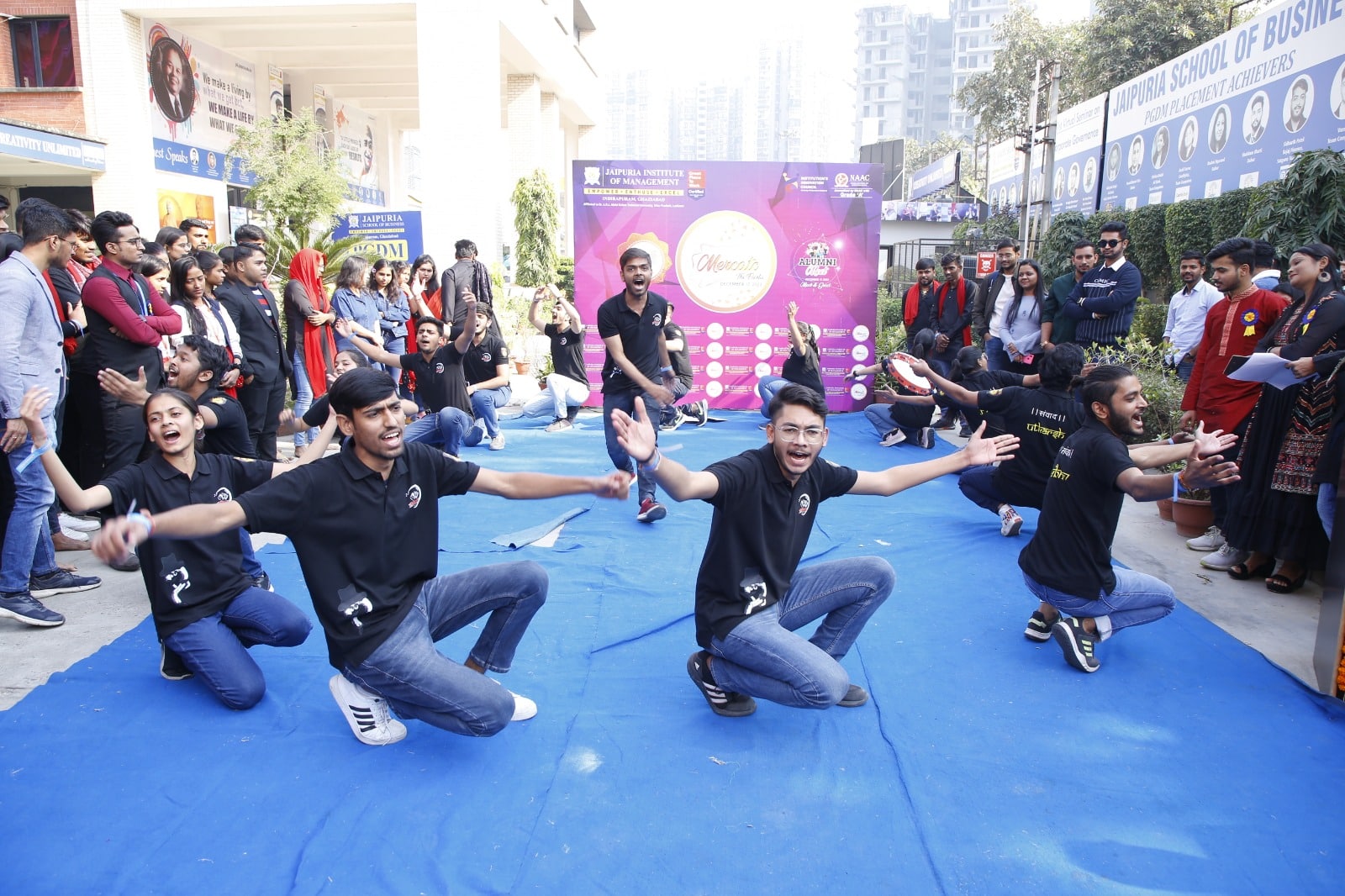 Students engaged in a dynamic performance for Nukkad Natak 'Aawahan' at the Mercato event.