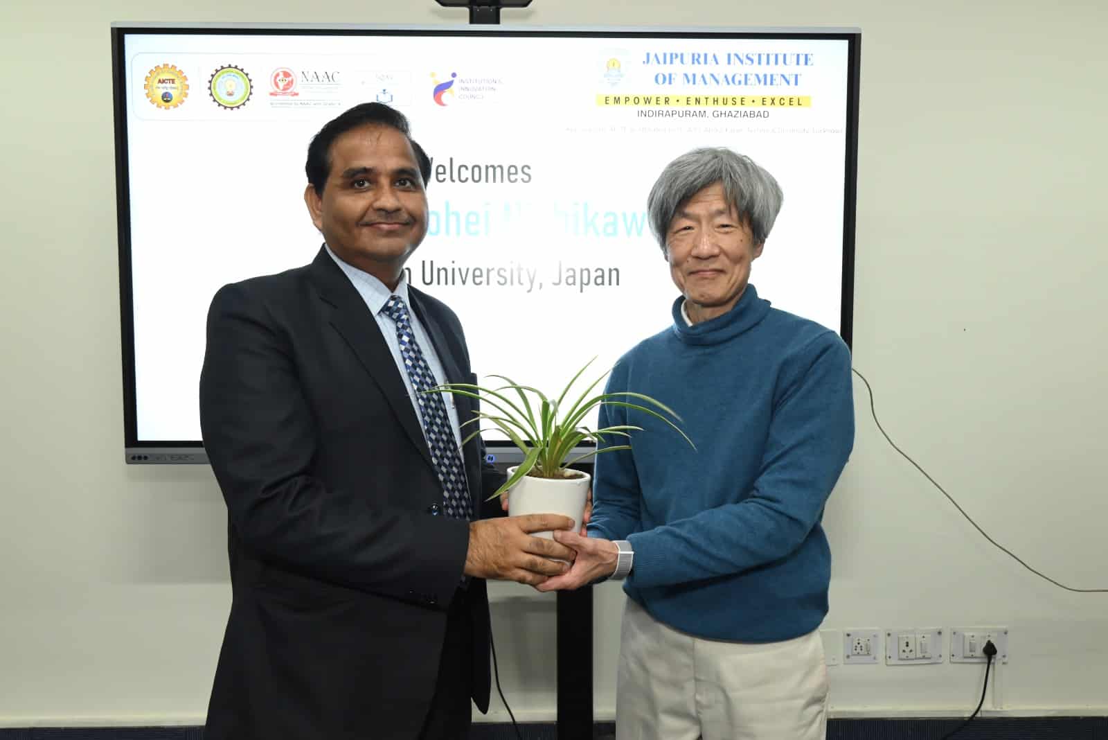 Prof. Kohei Nishikawa from Konan University being welcomed with a traditional plant gift by Prof. Dr Daviender Naraang at Jaipuria Institute of Management.